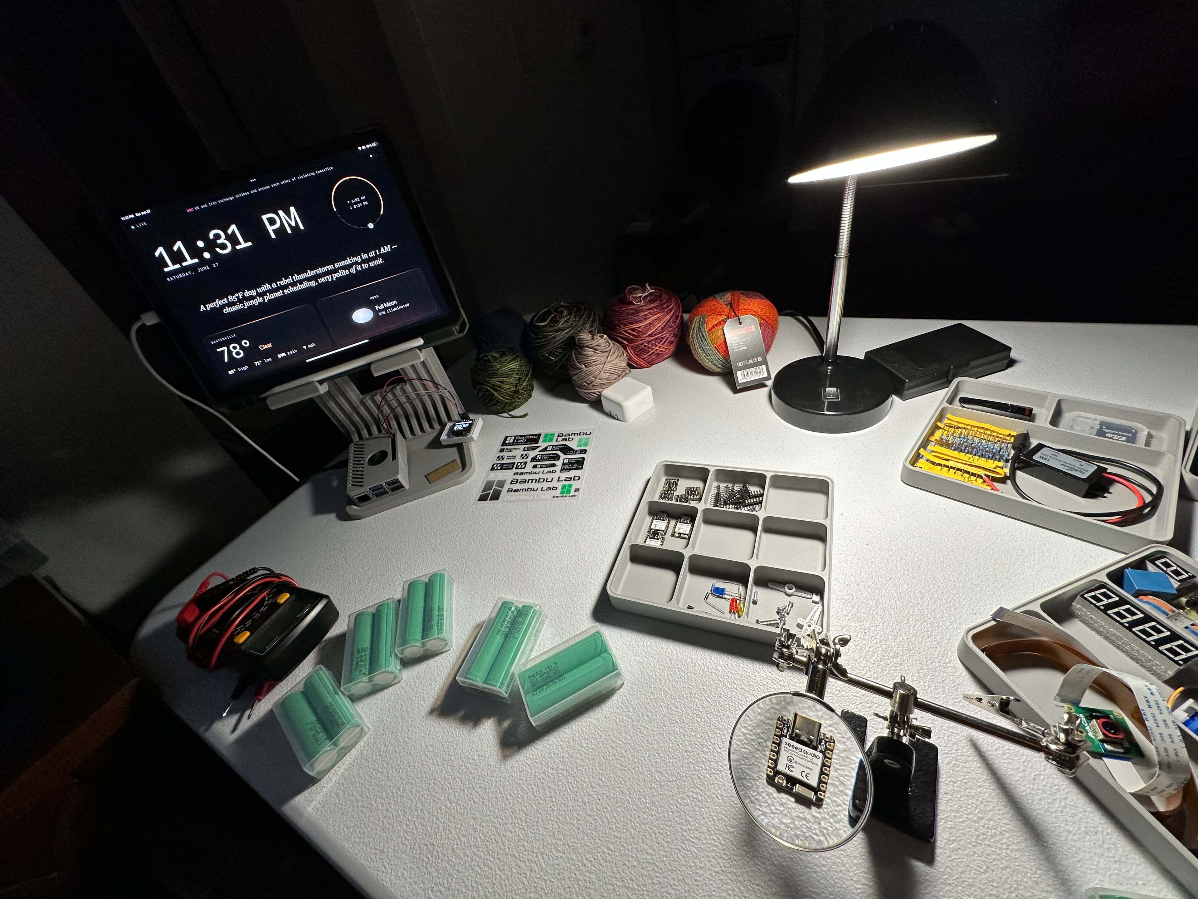 11:31 PM — the bench, the ambient dashboard glowing, a XIAO under the loupe.
