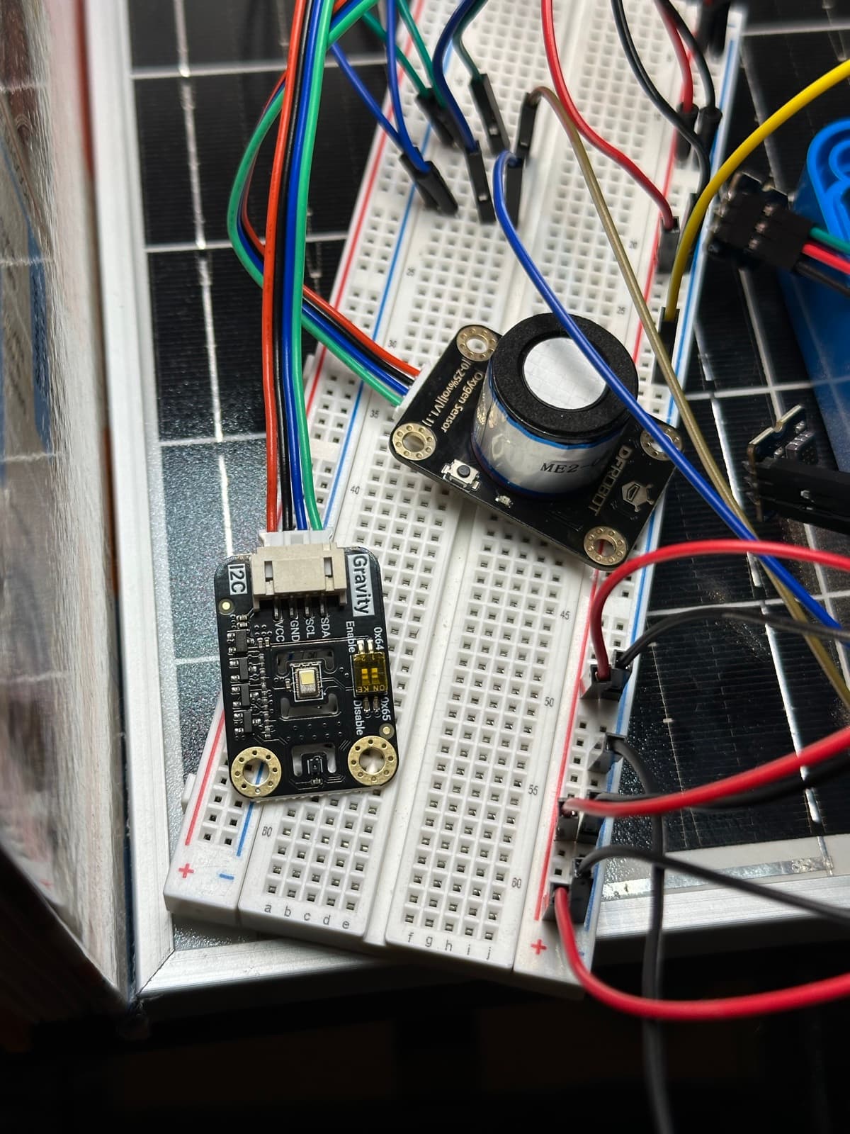 Gas sensing on the breadboard — electrochemical cell and breakout, staged on the panel.
